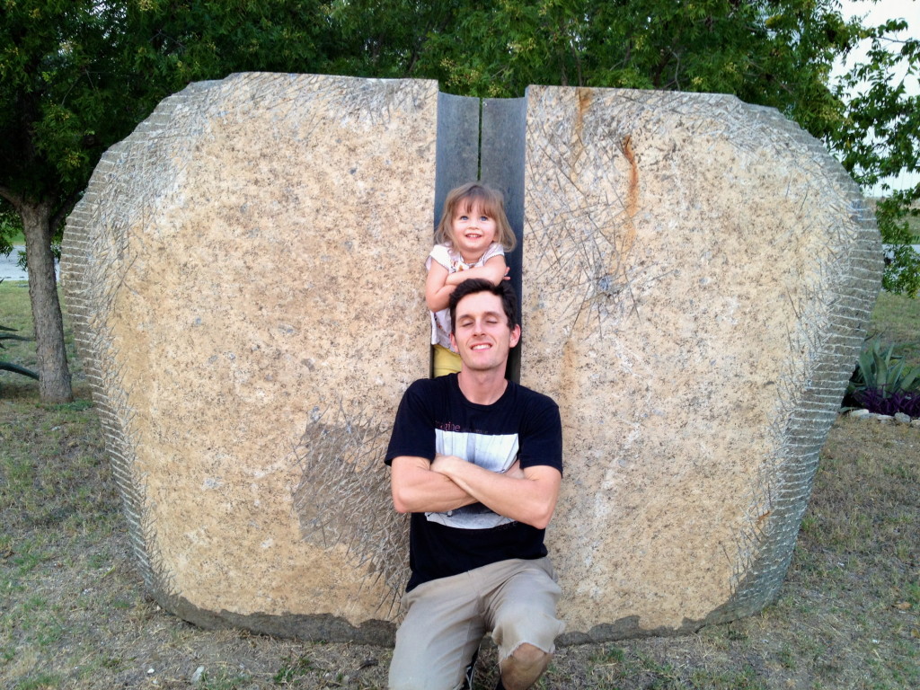 Kaliska Spencer enjoys one of the sculptures with her father, Jason. She says this piece reminds her of the giant stone that appears to walk away in the first selection of Walt Disney's Fantasia, Toccata and Fugue in D Minor by J. Bach.